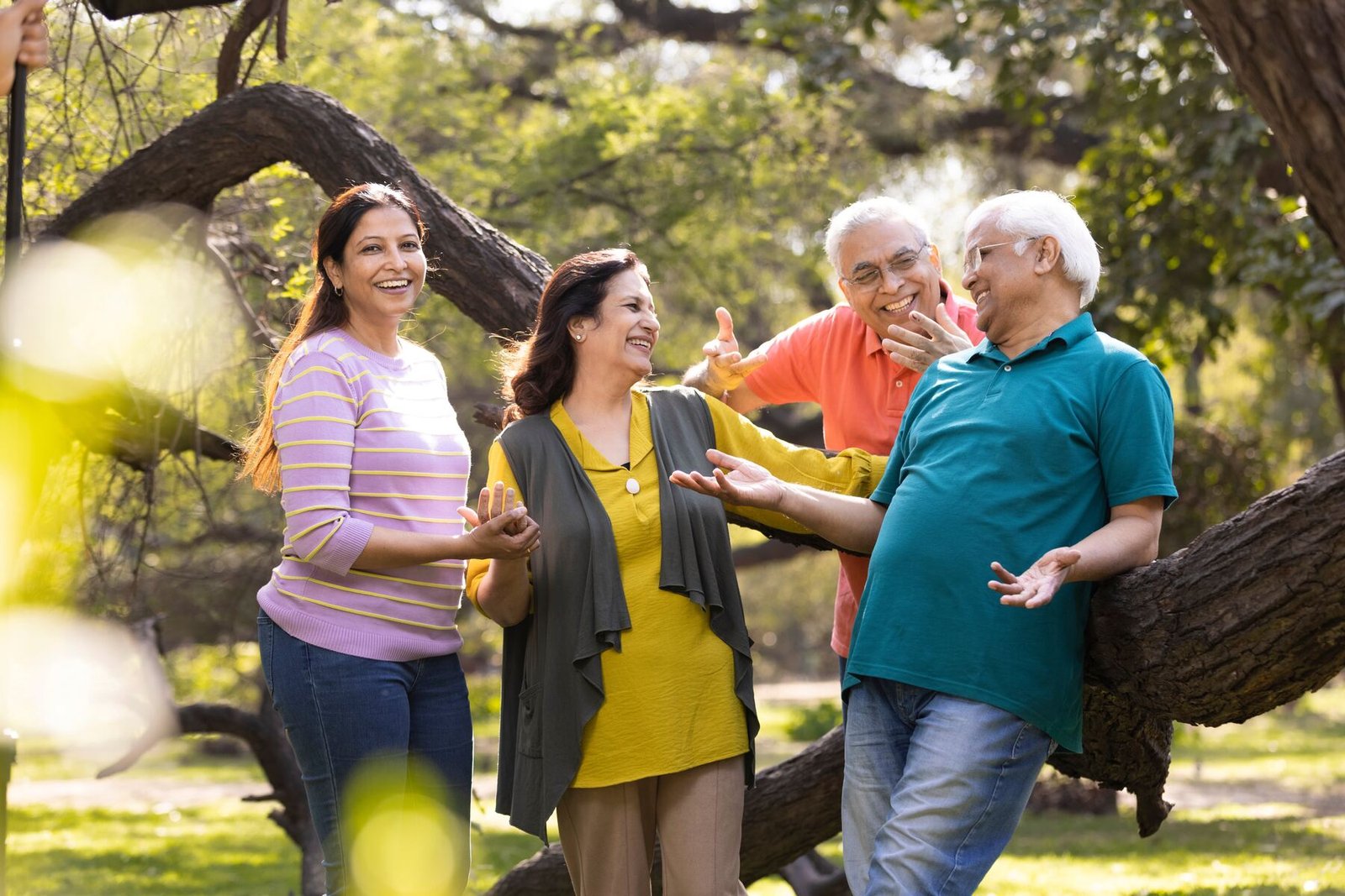 Friends laughing together in a park